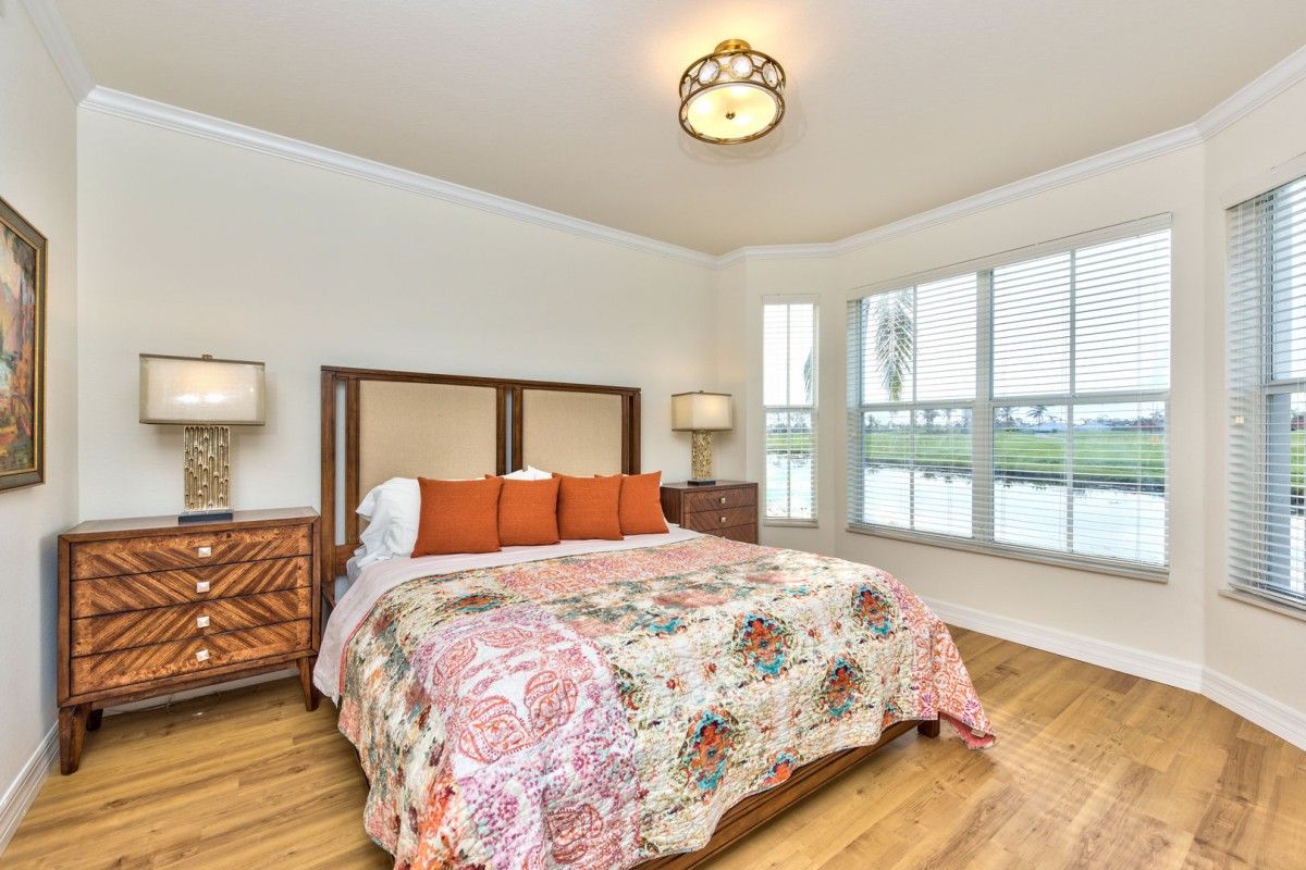 Bedroom of rental with wrap around lake view 
