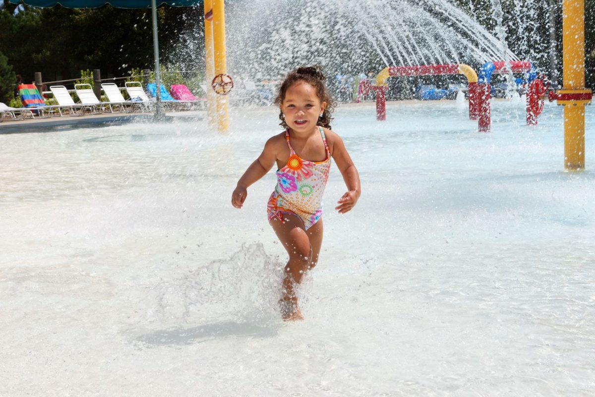 Child playing at water park